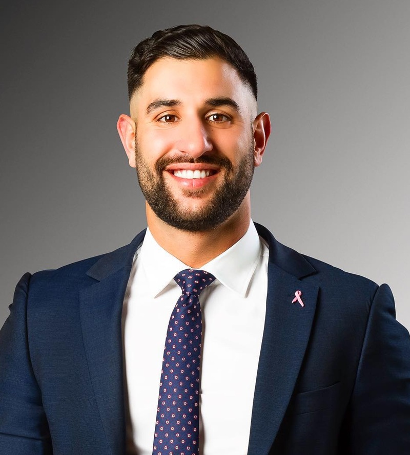 corporate beard that fades smoothly at the sideburns to frame a round face