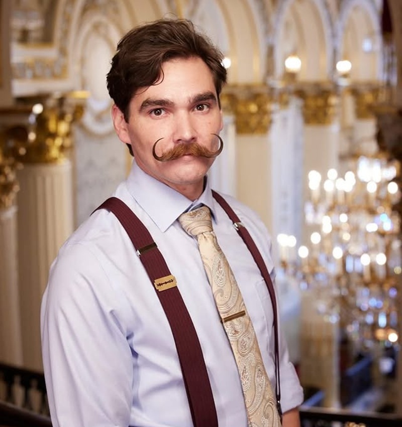 thick Imperial mustache with upward curl