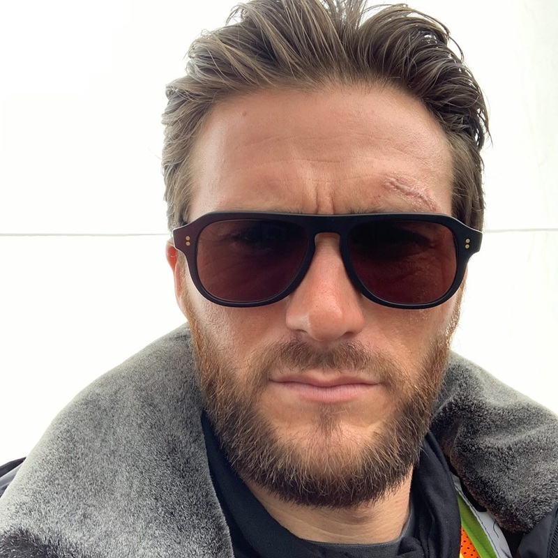 Scott Eastwood with a rugged medium-length full beard