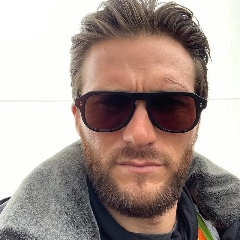 Scott Eastwood with a rugged medium-length full beard