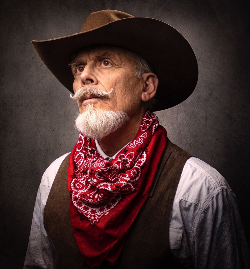 White handlebar mustache with a pointed cowboy beard
