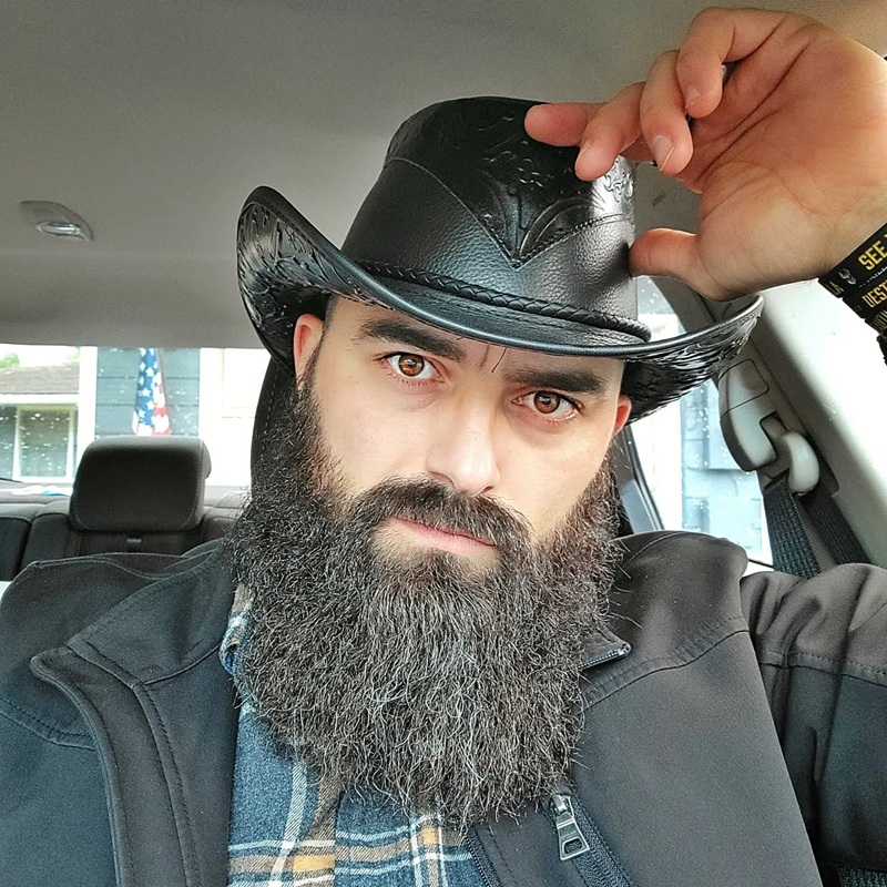 Thick, curly cowboy beard and mustache
