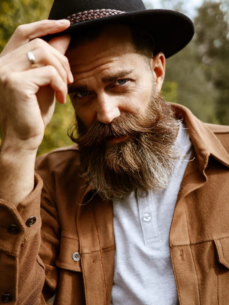 long handlebar mustache with a grizzled full cowboy beard