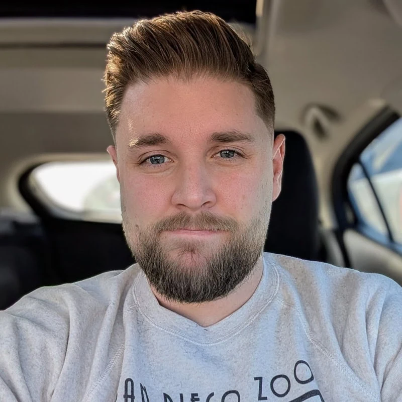 short full beard closely following the natural jawline of a round face