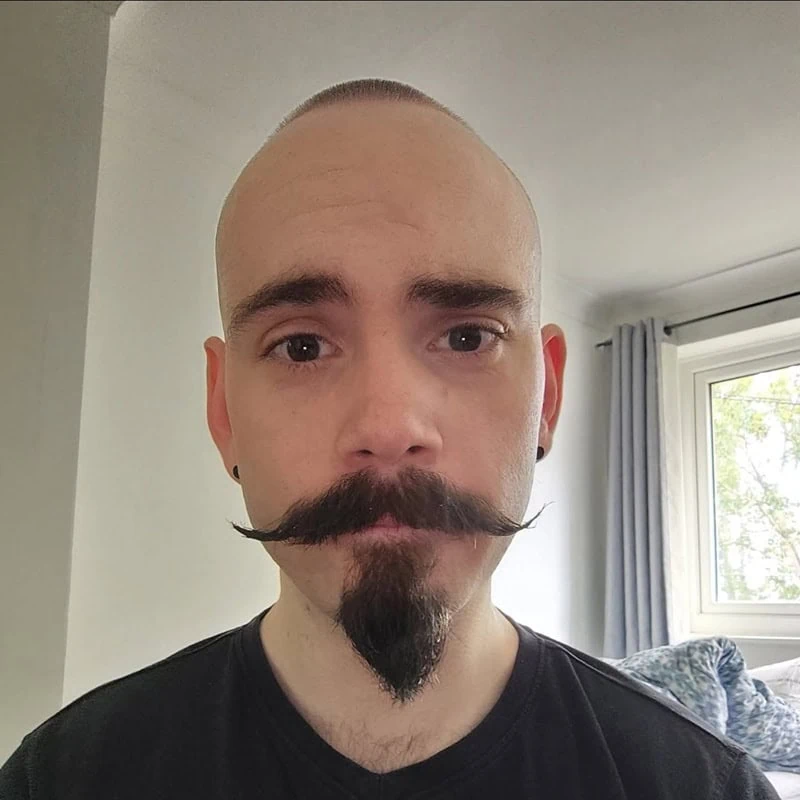 thick handlebar mustache with goatee beard